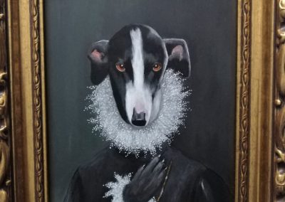The greyhound with the paw on the chest